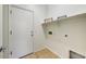 Functional laundry room with shelving and tile flooring at 12775 W Lowden Rd, Peoria, AZ 85383
