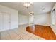Open-concept living room featuring tile and wood flooring at 12775 W Lowden Rd, Peoria, AZ 85383