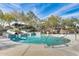 Community pool with a water slide, seating, and clear blue water for summer fun at 12775 W Lowden Rd, Peoria, AZ 85383
