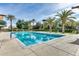 Resort-style pool with palm trees, lounge chairs, and clear blue water at 12775 W Lowden Rd, Peoria, AZ 85383