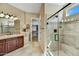 Bathroom showcases a glass shower enclosure, tile accents, and a wooden vanity at 12903 W Brookhart Way, Peoria, AZ 85383