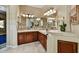 A double sink vanity and updated fixtures highlight the bathroom space at 12903 W Brookhart Way, Peoria, AZ 85383