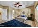 The main bedroom features neutral color palette, and ensuite bathroom access at 12903 W Brookhart Way, Peoria, AZ 85383