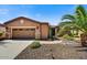 Inviting single-story home with a two-car garage and desert landscaping at 12903 W Brookhart Way, Peoria, AZ 85383
