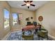 Comfortable home office with large window and decorative rug at 12903 W Brookhart Way, Peoria, AZ 85383