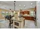 The spacious kitchen offers an island, stainless steel appliances, and tile flooring at 12903 W Brookhart Way, Peoria, AZ 85383