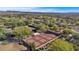 An aerial view of pickleball courts within a community surrounded by trees, landscaping, and scenic views at 12903 W Brookhart Way, Peoria, AZ 85383