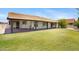 Expansive backyard with covered patio, lush lawn and mature trees at 13010 S 42Nd St, Phoenix, AZ 85044