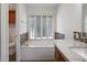 Bathroom with a soaking tub and white shutters at 13010 S 42Nd St, Phoenix, AZ 85044