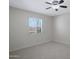 Neutral bedroom with a ceiling fan, shutters, and carpeted floor at 13010 S 42Nd St, Phoenix, AZ 85044