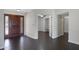 Inviting entryway with a wooden door featuring glass and dark wood flooring at 13010 S 42Nd St, Phoenix, AZ 85044