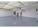 Spacious garage with epoxy flooring, storage and insulated doors at 13010 S 42Nd St, Phoenix, AZ 85044