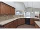 Granite counter tops and custom cabinets in this lovely kitchen at 13010 S 42Nd St, Phoenix, AZ 85044