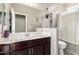 Bathroom featuring a single sink vanity and a shower-tub combination, creating a practical and clean space at 13153 W Cottontail Ln, Peoria, AZ 85383