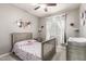 Comfortable bedroom with decorative wall art, a ceiling fan, and a cozy bed at 13153 W Cottontail Ln, Peoria, AZ 85383