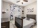 Decorated bedroom featuring modern curtains, a ceiling fan, and sports-themed wall art at 13153 W Cottontail Ln, Peoria, AZ 85383