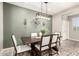 Stylish dining room featuring modern lighting and room to gather at 13153 W Cottontail Ln, Peoria, AZ 85383
