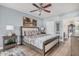 Comfortable bedroom with neutral paint, ceiling fan, and wood-look flooring at 15095 N Thompson Peak Pkwy # 1005, Scottsdale, AZ 85260