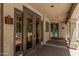 Community building entrance with brick walkway, sauna, steam room, and a glimpse of the pool at 15095 N Thompson Peak Pkwy # 1005, Scottsdale, AZ 85260
