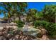 Serene community view featuring mature trees, lush landscaping, and calming water feature at 15095 N Thompson Peak Pkwy # 1005, Scottsdale, AZ 85260