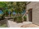 Well-maintained community pathway leading to building entrance, surrounded by manicured landscaping at 15095 N Thompson Peak Pkwy # 1005, Scottsdale, AZ 85260