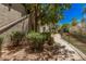 Picturesque walkway lined with trees and shrubs alongside building exterior at 15095 N Thompson Peak Pkwy # 1005, Scottsdale, AZ 85260