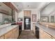 Bright kitchen featuring a tiled floor, breakfast bar, and black appliances at 15095 N Thompson Peak Pkwy # 1005, Scottsdale, AZ 85260