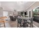 Open-concept living and dining area featuring a comfortable leather sofa and modern decor at 15095 N Thompson Peak Pkwy # 1005, Scottsdale, AZ 85260