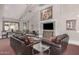 Relaxing lounge area featuring leather sofas, a large TV, and sophisticated decor at 15095 N Thompson Peak Pkwy # 1005, Scottsdale, AZ 85260