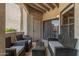 Relaxing outdoor patio with comfortable seating and a glass-topped table at 15095 N Thompson Peak Pkwy # 1005, Scottsdale, AZ 85260