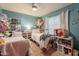 Colorful bedroom with two twin beds, perfect for siblings or guests at 15211 N 89Th Ave, Peoria, AZ 85381