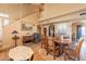 View of the dining room and staircase, featuring dark wood furniture at 15211 N 89Th Ave, Peoria, AZ 85381