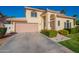 Two-story home featuring a two-car garage and desert landscaping at 15211 N 89Th Ave, Peoria, AZ 85381