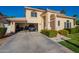 Attached two car garage featuring storage shelves and a parked vehicle at 15211 N 89Th Ave, Peoria, AZ 85381