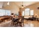 Open concept living room with high ceilings and large windows at 15211 N 89Th Ave, Peoria, AZ 85381