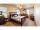Comfortable main bedroom features a ceiling fan and coordinated furniture at 15211 N 89Th Ave, Peoria, AZ 85381
