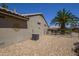 Backyard with desert landscaping, including a palm tree and various plants at 15658 W Arbor Trl, Surprise, AZ 85374