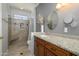 Bathroom with granite countertop vanity and a shower at 15658 W Arbor Trl, Surprise, AZ 85374
