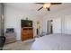 Bedroom with ceiling fan and en suite bath at 15658 W Arbor Trl, Surprise, AZ 85374