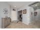 Inviting entryway featuring neutral walls, tiled floors, and a decorative accent table at 15658 W Arbor Trl, Surprise, AZ 85374