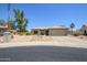 Attractive one-story home featuring desert landscaping, a beige exterior, and a two-car garage at 15658 W Arbor Trl, Surprise, AZ 85374