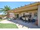 Large covered patio offers ample seating and dining space with a grill perfect for entertaining at 15658 W Arbor Trl, Surprise, AZ 85374
