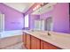 Bright bathroom with double sinks, bathtub, and separate shower at 16242 W Caribbean Ln, Surprise, AZ 85379