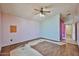 Spacious bedroom with wood-look floors partially removed, ready for personalization at 16242 W Caribbean Ln, Surprise, AZ 85379