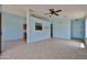 Spacious living area with neutral walls, tile flooring, and natural light at 16242 W Caribbean Ln, Surprise, AZ 85379