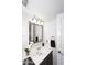 Bathroom features white counter top, vanity, modern fixtures and mirror at 1640 W Gail Dr, Chandler, AZ 85224