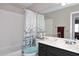 Bathroom with a tub-shower combo and dark vanity at 1640 W Gail Dr, Chandler, AZ 85224