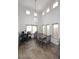 Dining room with high ceilings, a modern chandelier, a wooden table with upholstered chairs, and tile flooring at 1640 W Gail Dr, Chandler, AZ 85224
