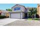 Charming two-story home with attached garage, tile roof and a low maintenance gravel yard at 1640 W Gail Dr, Chandler, AZ 85224