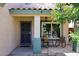 Cozy front porch with seating area and decorative elements, creating a welcoming entrance to the home at 1640 W Gail Dr, Chandler, AZ 85224